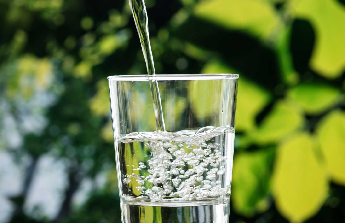 Clean water being poured into a glass